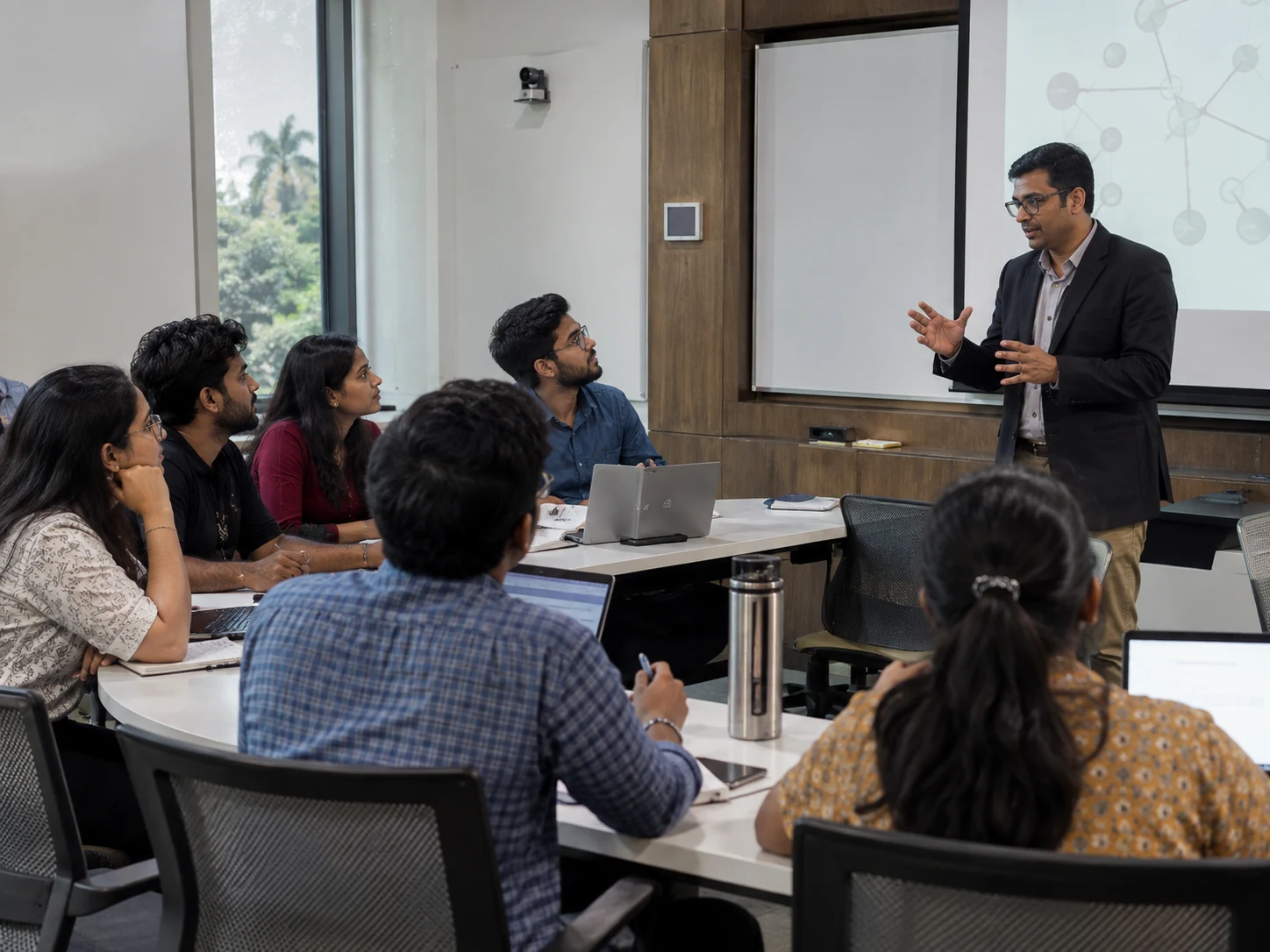 Postgraduate students attending an interactive classroom session